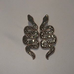 Snake Earrings. Shimmery gold and brown leather material.